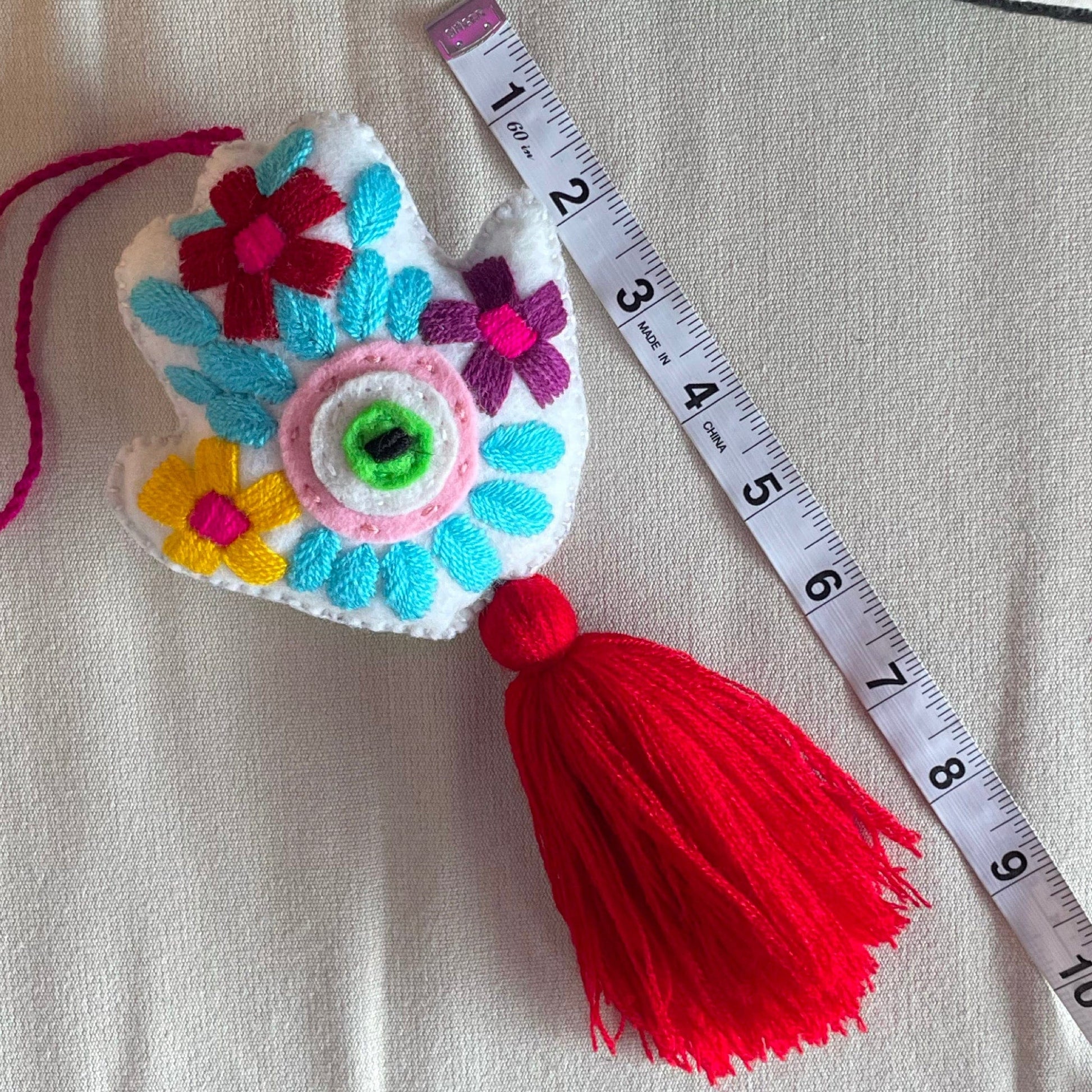 Evil Eye Hand Pom-Pom - Ojo Turco Evil Eye Hand Pom-Pom - Ojo Turco