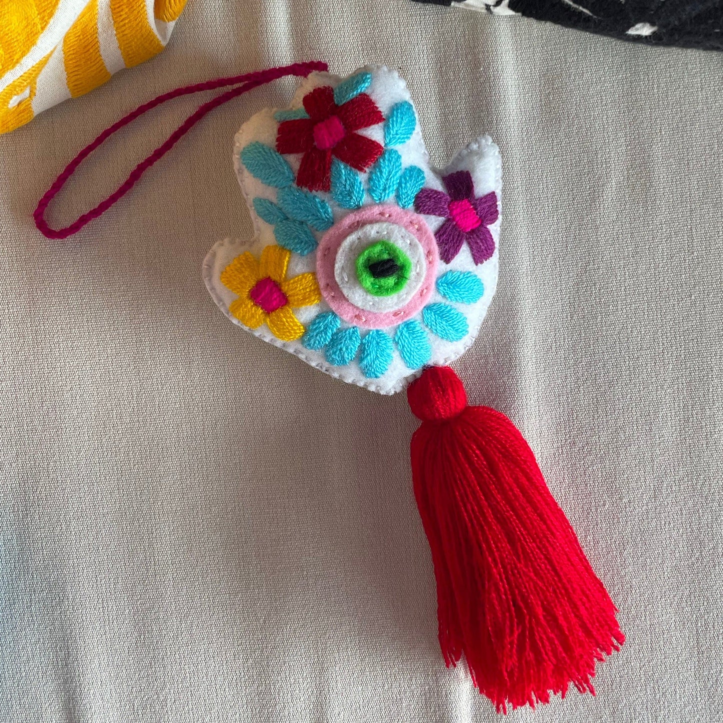 Evil Eye Hand Pom-Pom - Ojo Turco Evil Eye Hand Pom-Pom - Ojo Turco