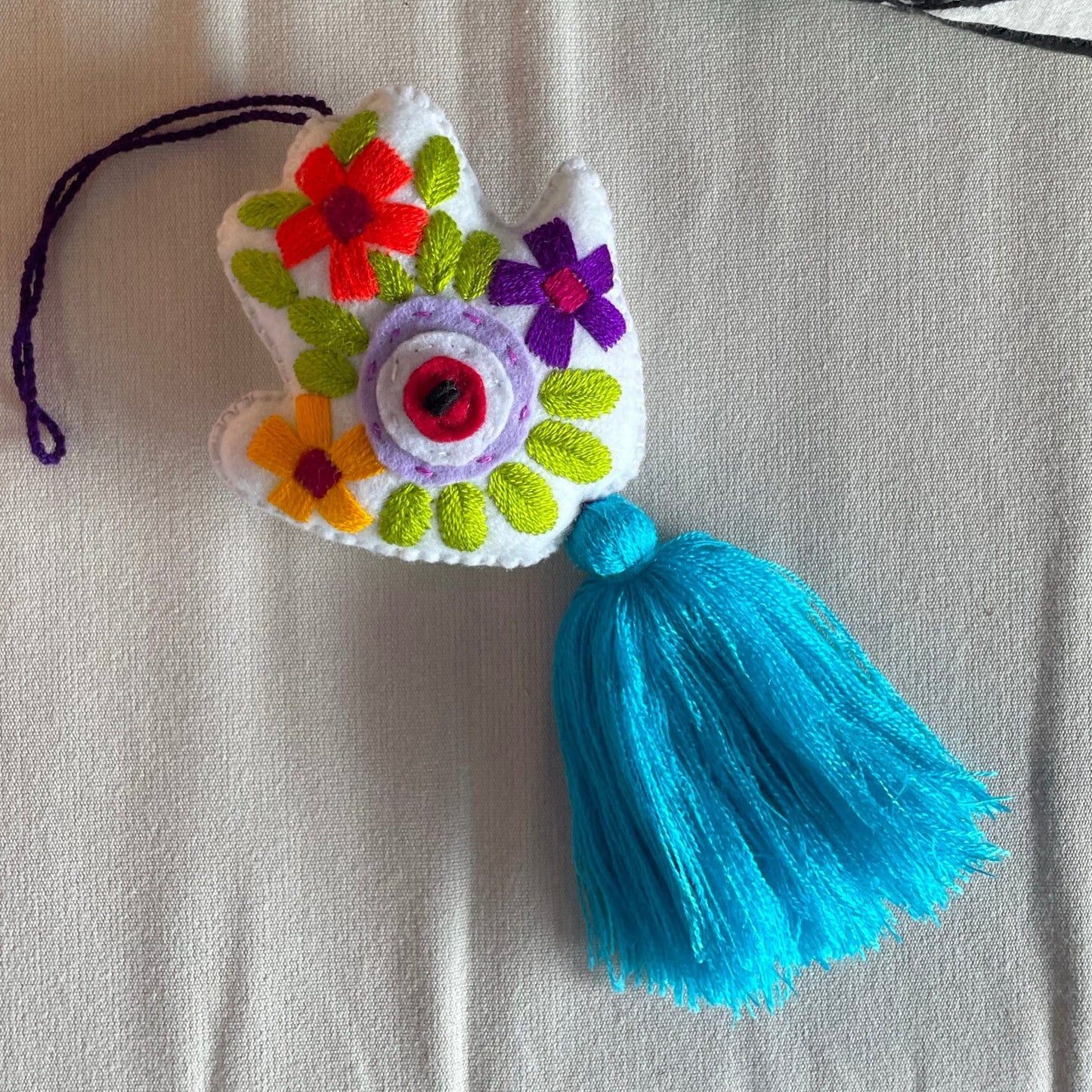 Evil Eye Hand Pom-Pom - Ojo Turco Evil Eye Hand Pom-Pom - Ojo Turco