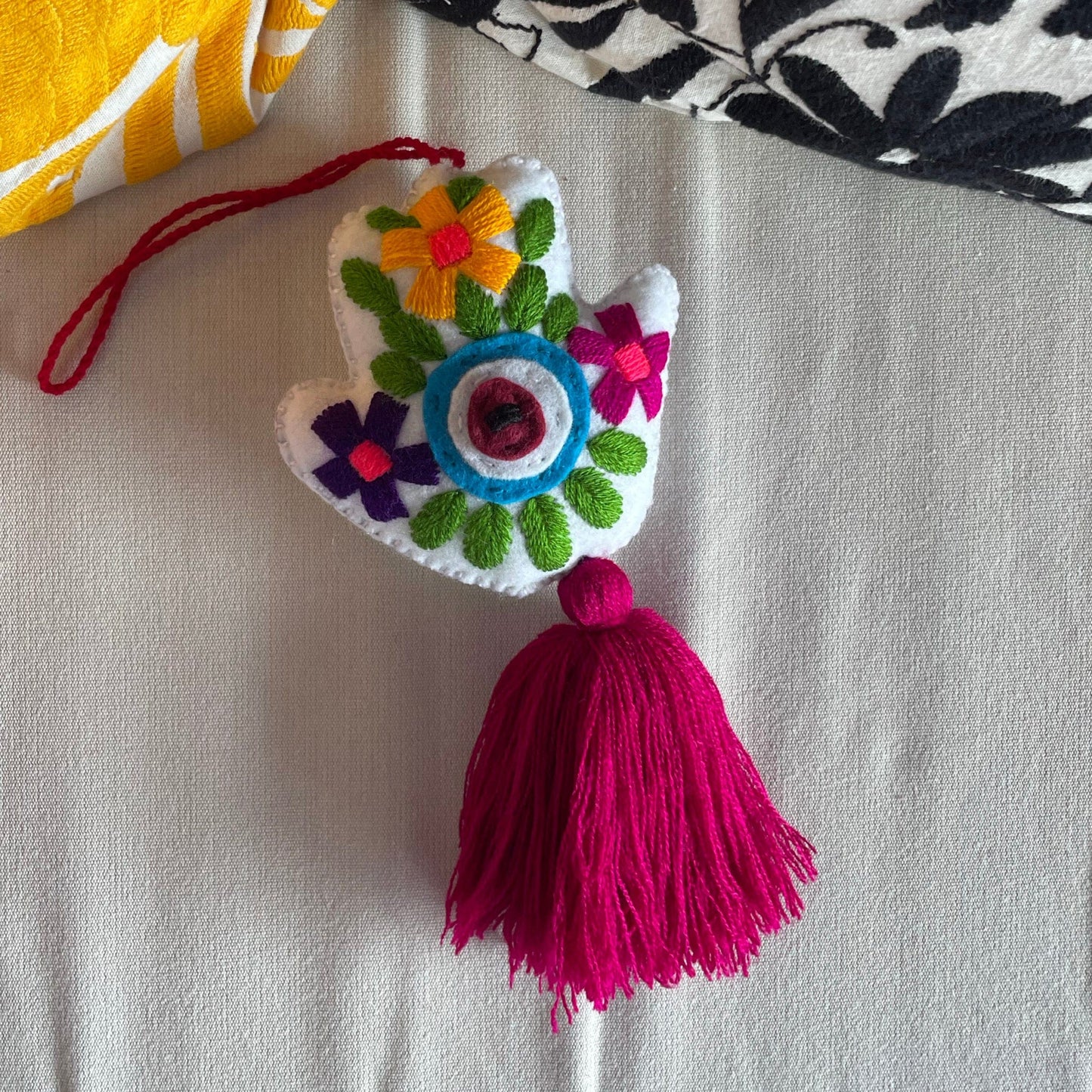 Evil Eye Hand Pom-Pom - Ojo Turco Evil Eye Hand Pom-Pom - Ojo Turco