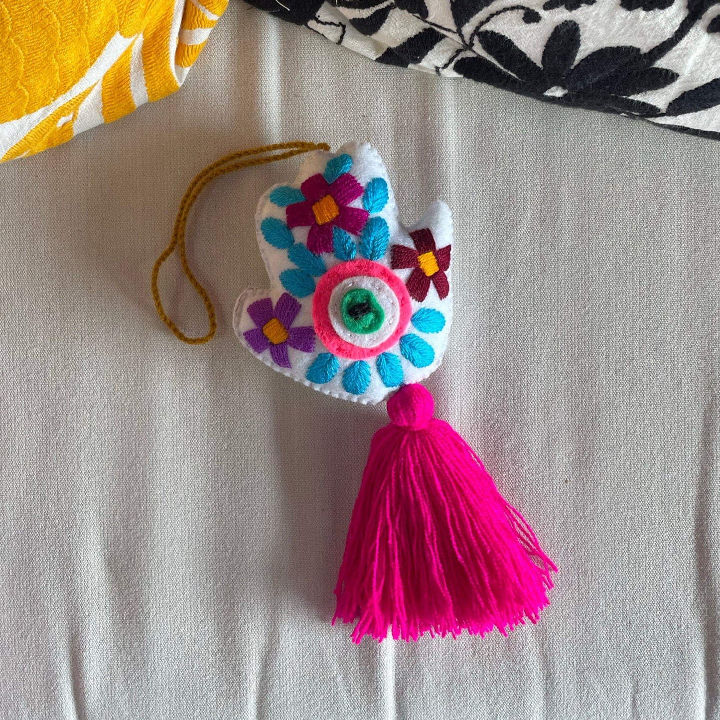 Evil Eye Hand Pom-Pom - Ojo Turco Evil Eye Hand Pom-Pom - Ojo Turco