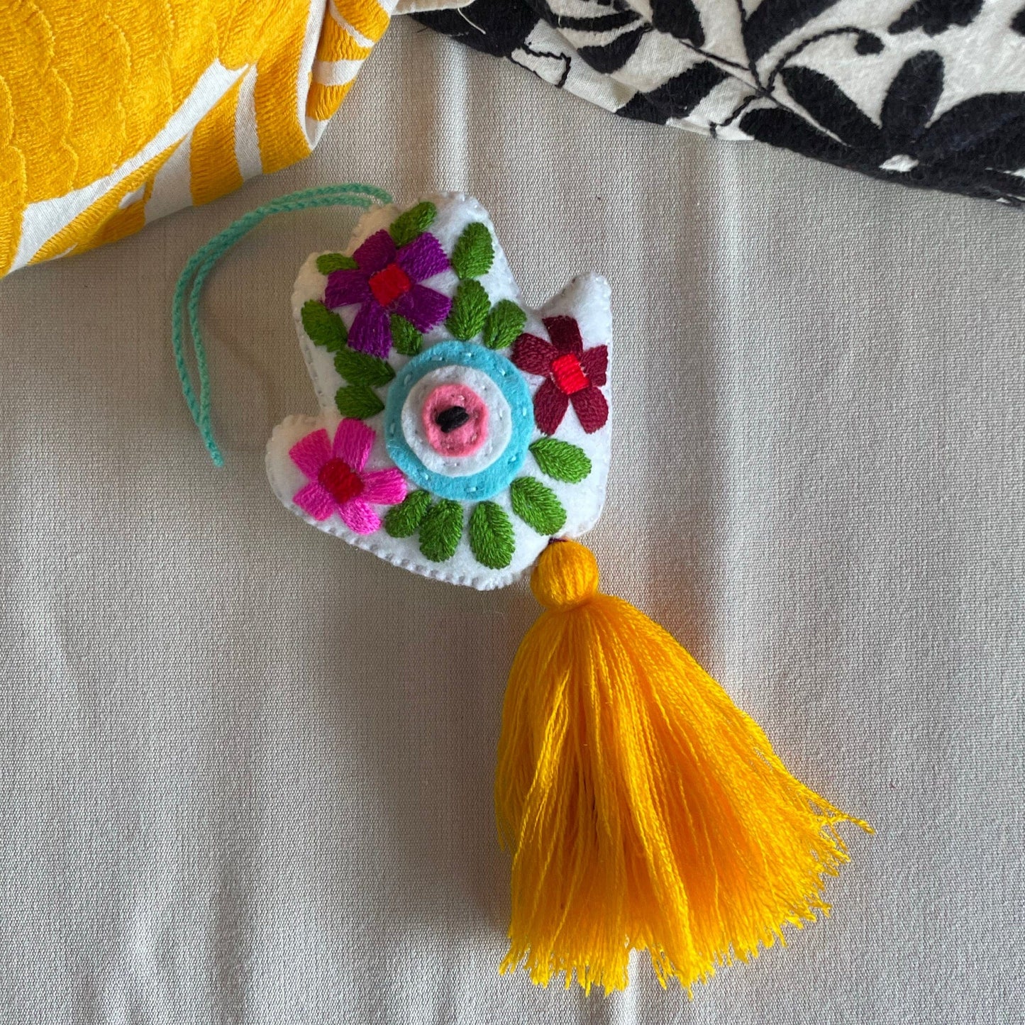 Evil Eye Hand Pom-Pom - Ojo Turco Evil Eye Hand Pom-Pom - Ojo Turco