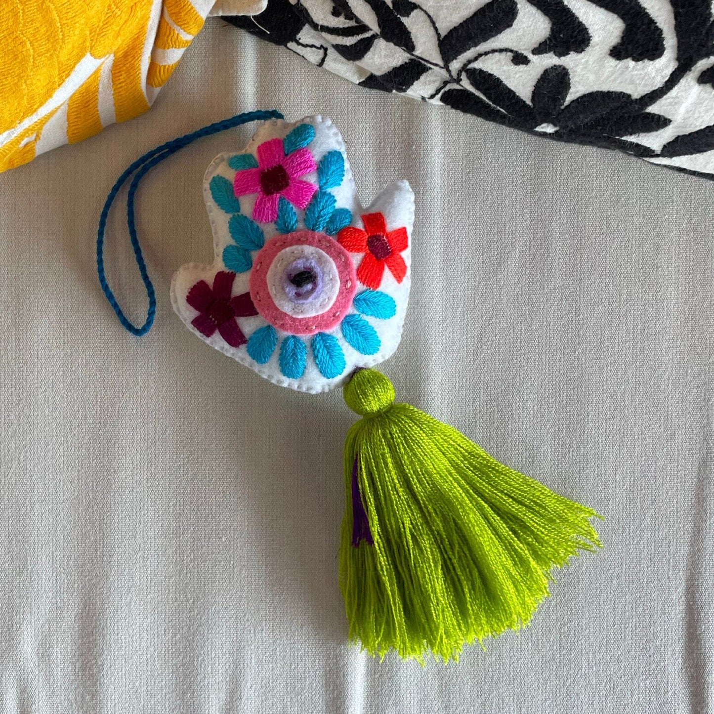 Evil Eye Hand Pom-Pom - Ojo Turco Evil Eye Hand Pom-Pom - Ojo Turco